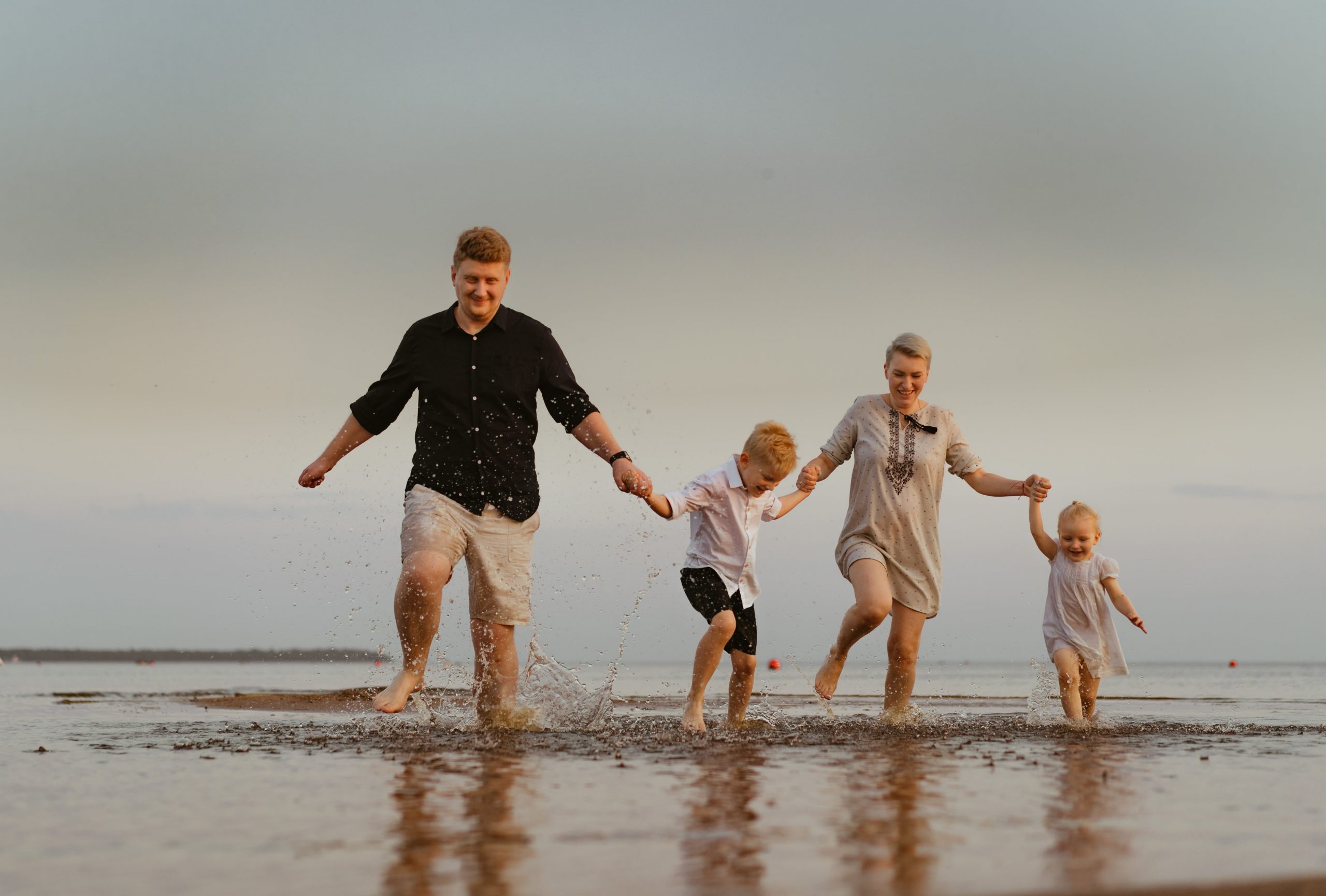 family having fun on holiday at the sea after resolving relationship stress